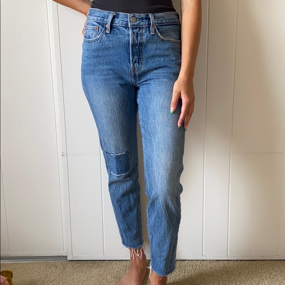 Levi’s button fly size 27 distressed jeans